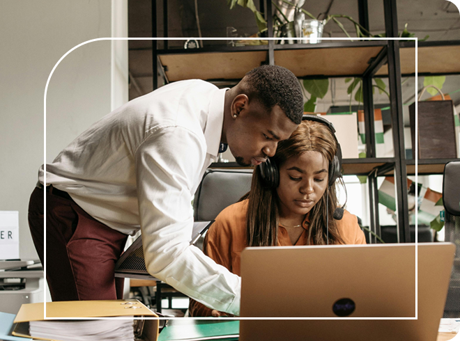 Two people in a startup reviewing information